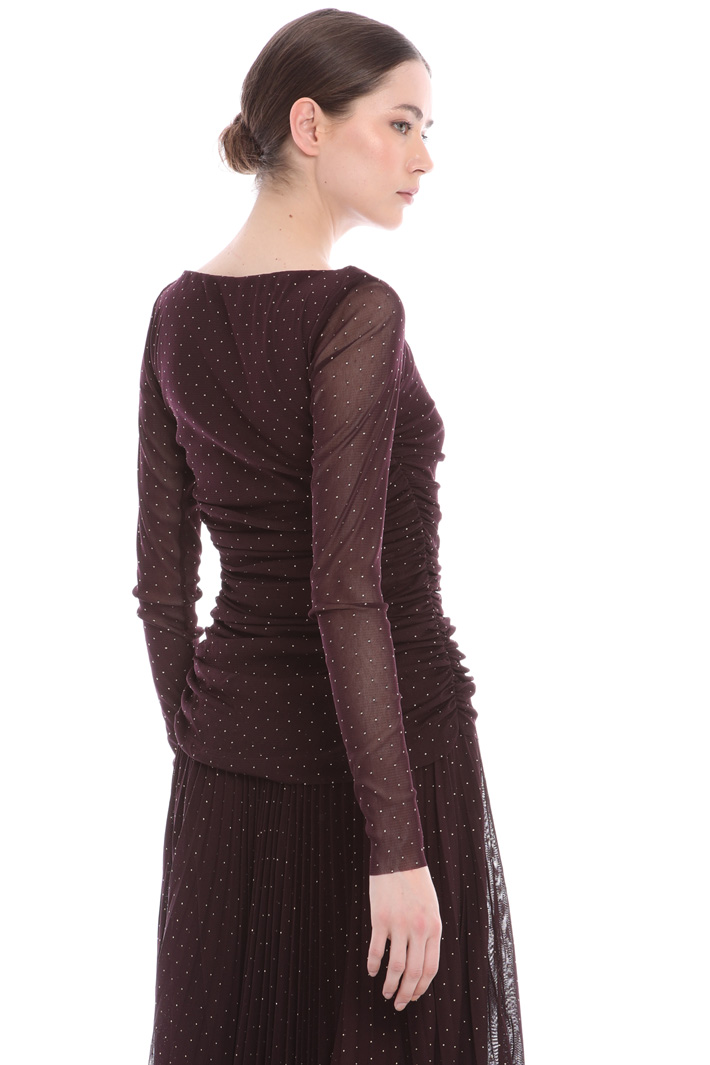 Stretchy tulle top
Intrend Stretchy tulle top
Intrend