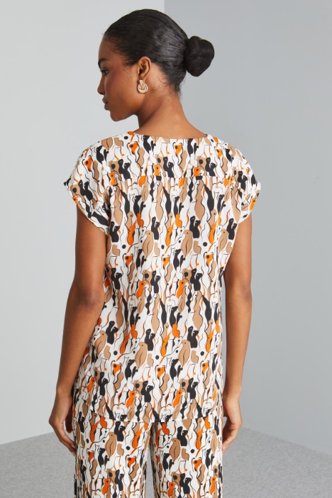 Blusa con maniche ad aletta