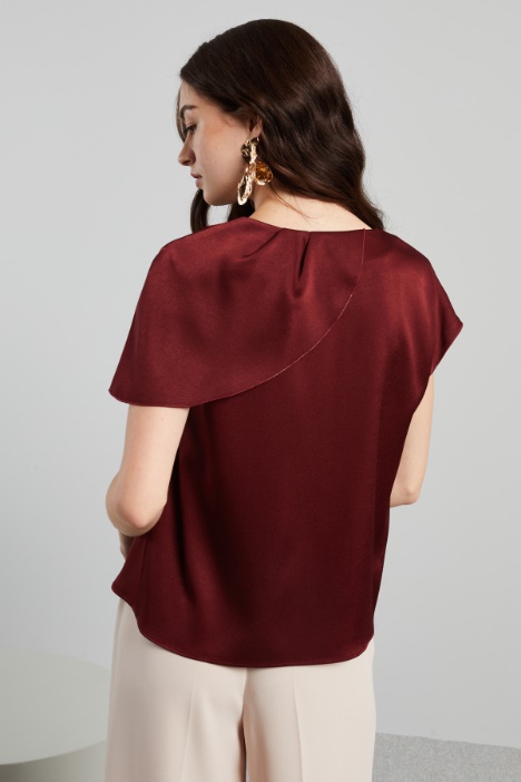 Blusa con drappeggio