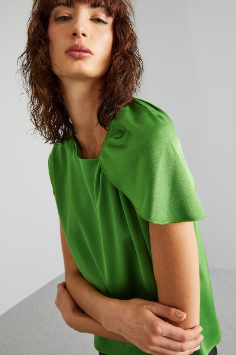 Blusa con drappeggio