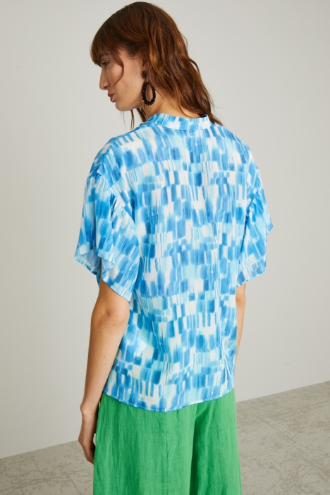 Blusa con chiusura a polo