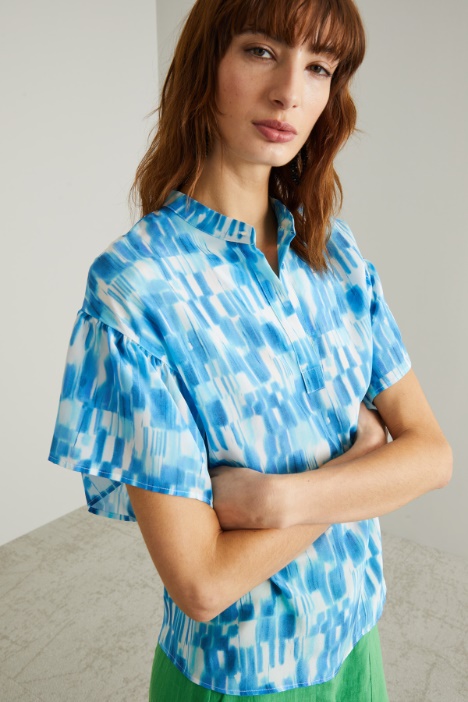 Blusa con chiusura a polo