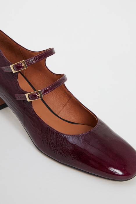 Décolleté in vernice con cinturini