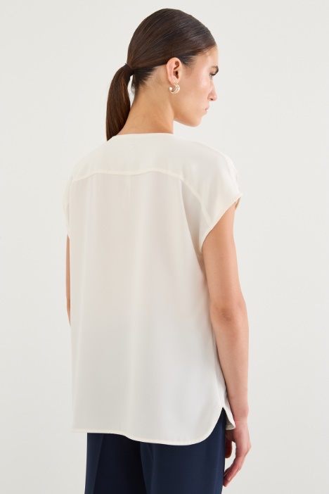Blusa con pliegues doblados