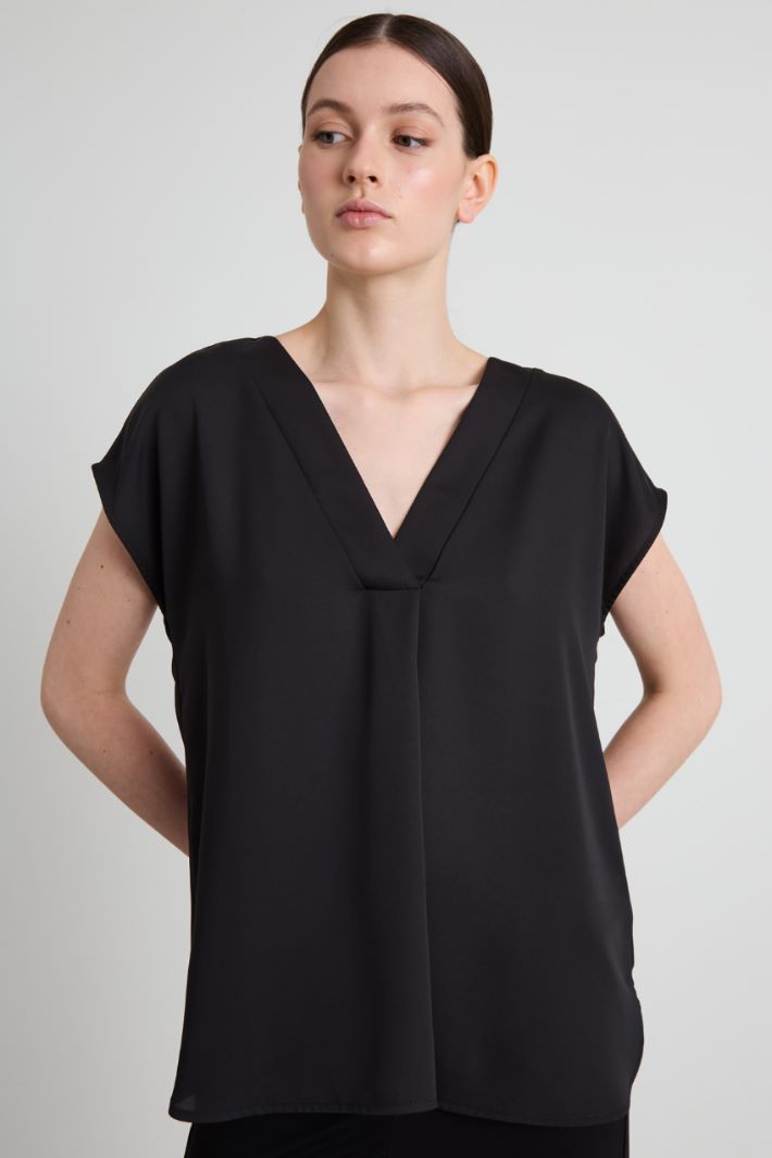 Blusa con pliegues doblados