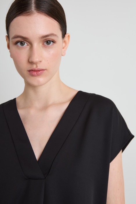 Blusa con piega ribattuta