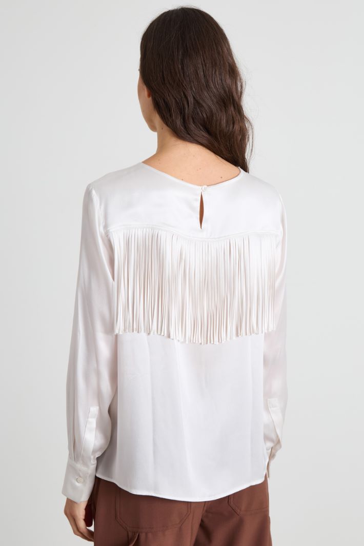 Blusa con flecos