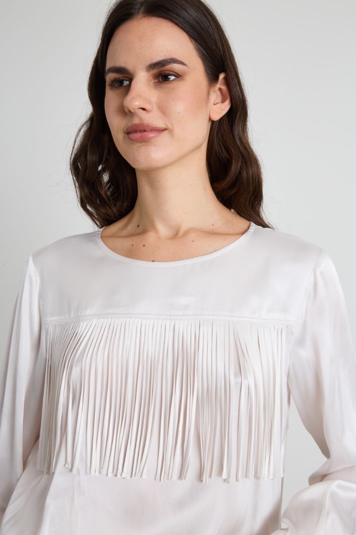 Blusa con flecos