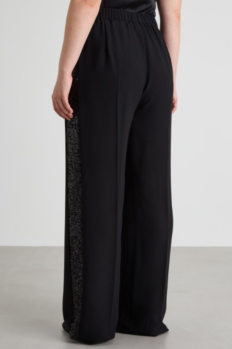 Pantaloni con bande di paillettes