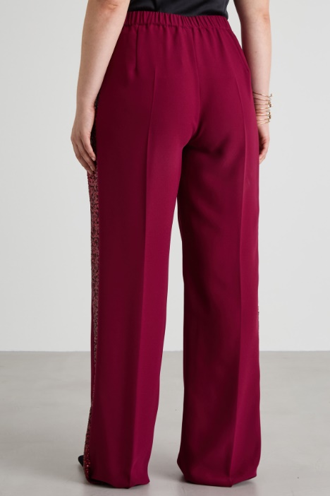 Pantaloni con bande di paillettes