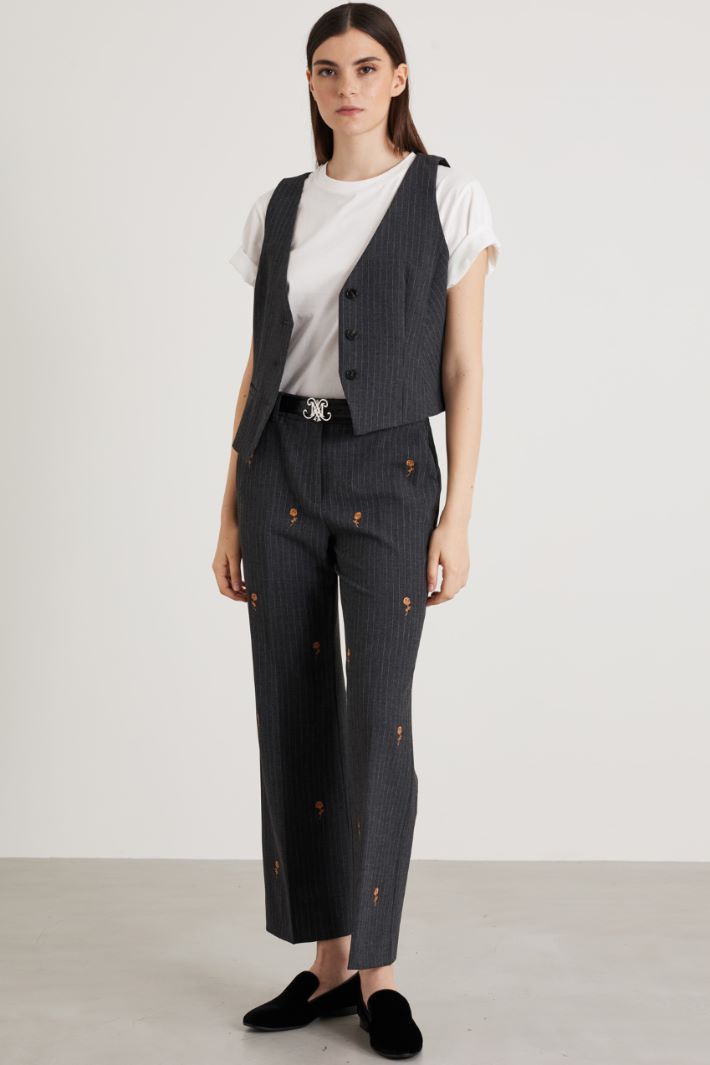 Pantaloni gessati con ricami
