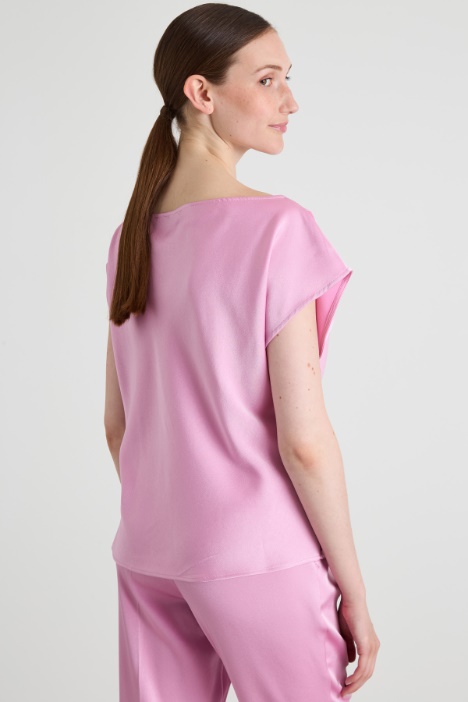 Top asimmetrico con drappeggio