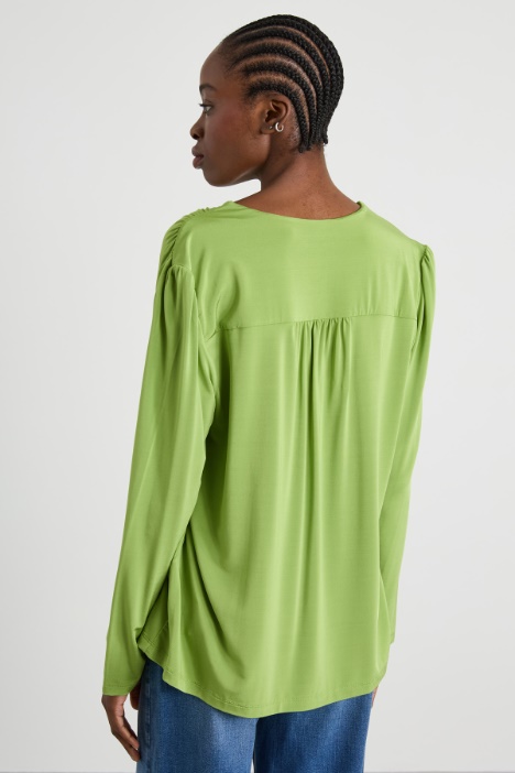 Blusa con nastro a fiore