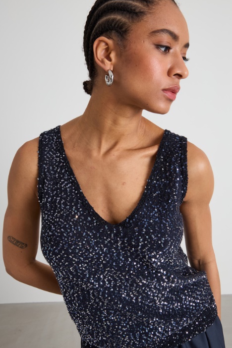 Top in maglia con paillettes
