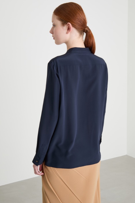Blusa con tasche multiple