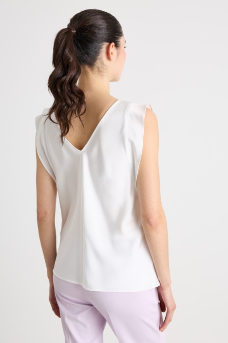Blusa in raso con volant laterali