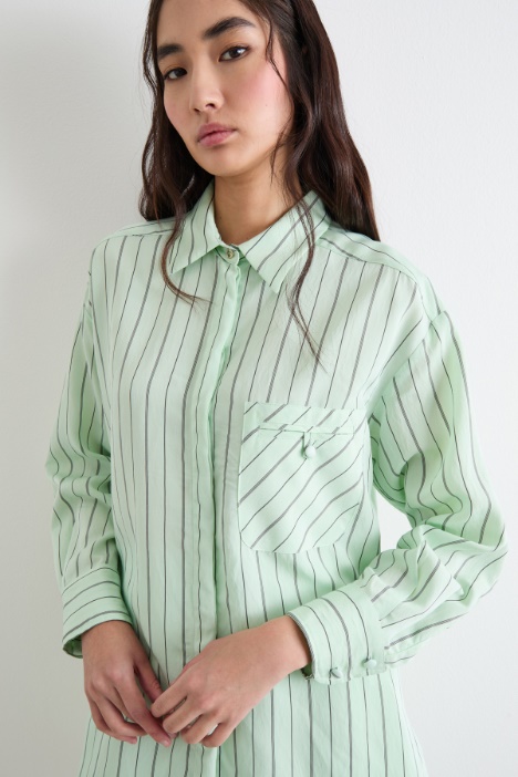 Blusa fluida con taschino