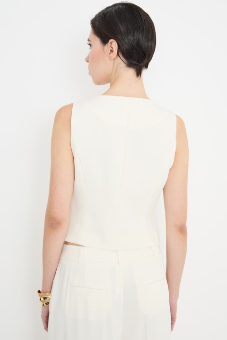 Gilet aderente con tasche