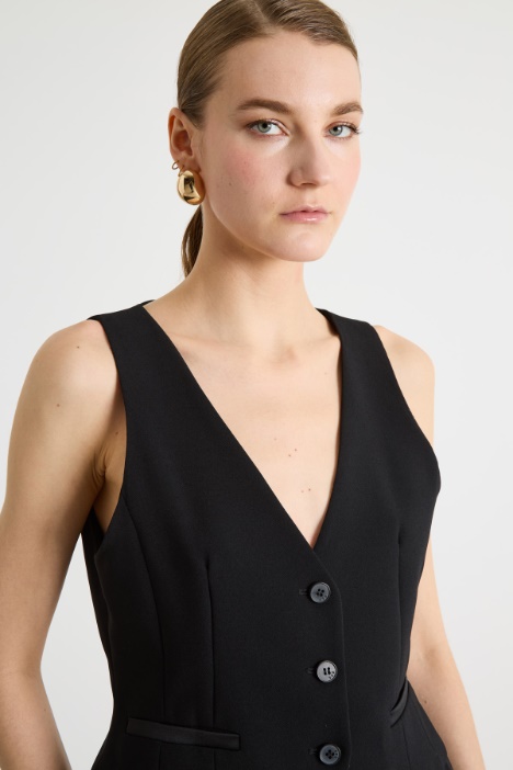 Gilet aderente con tasche