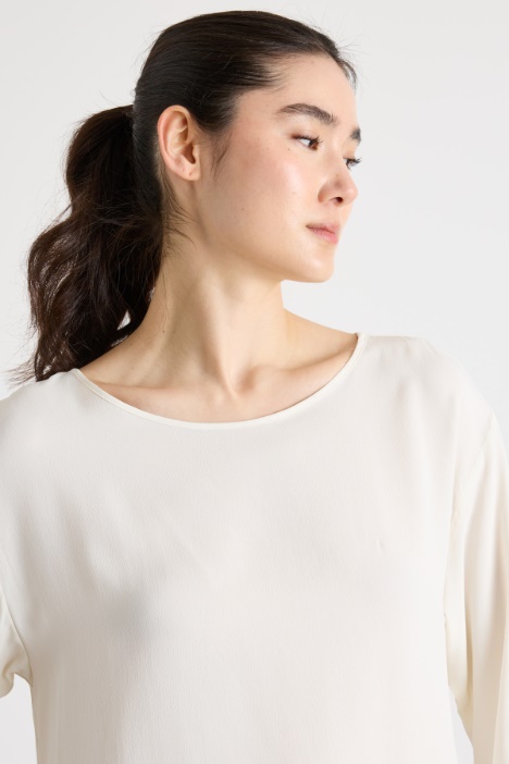 Blusa con fondo asimmetrico