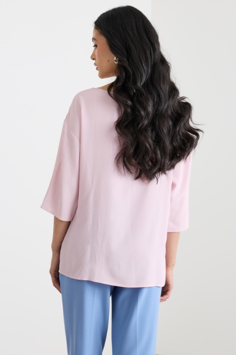 Blusa con fondo asimmetrico