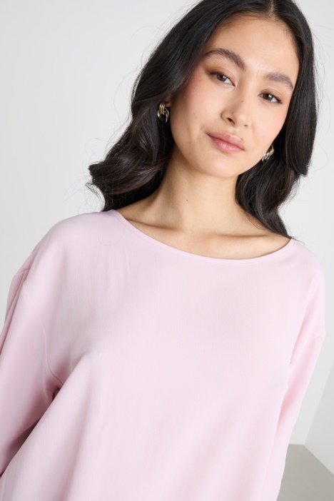 Blusa con fondo asimmetrico