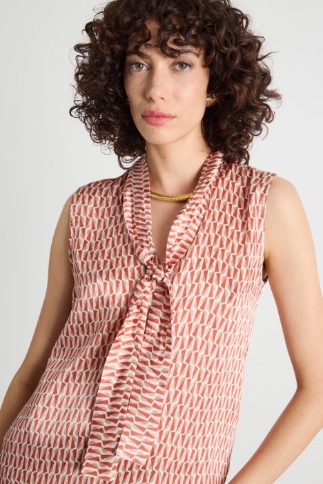 Top smanicato in creponne