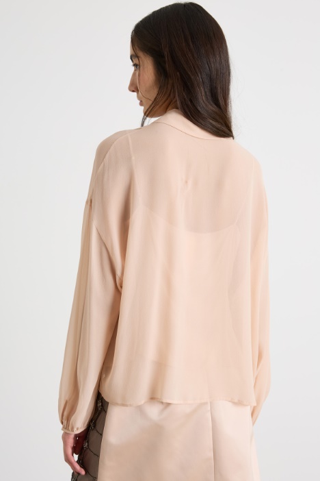 Blusa con maniche a sbuffo