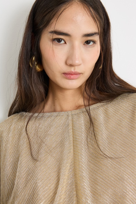 Top in tessuto laminato