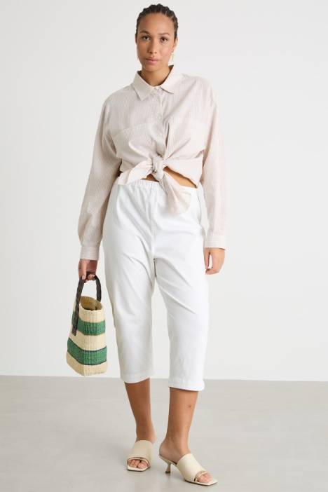 Cropped slit-hem trousers Intrend