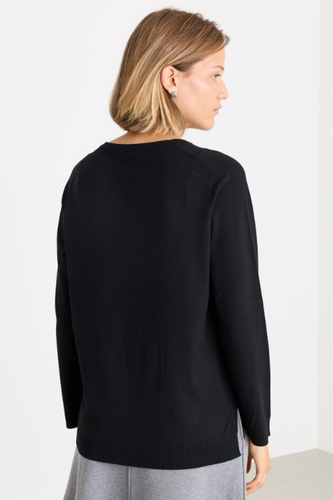 Maglia con fondo asimmetrico