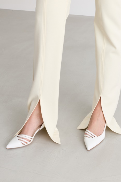 Pantalone in gabardina e jersey con spacco
